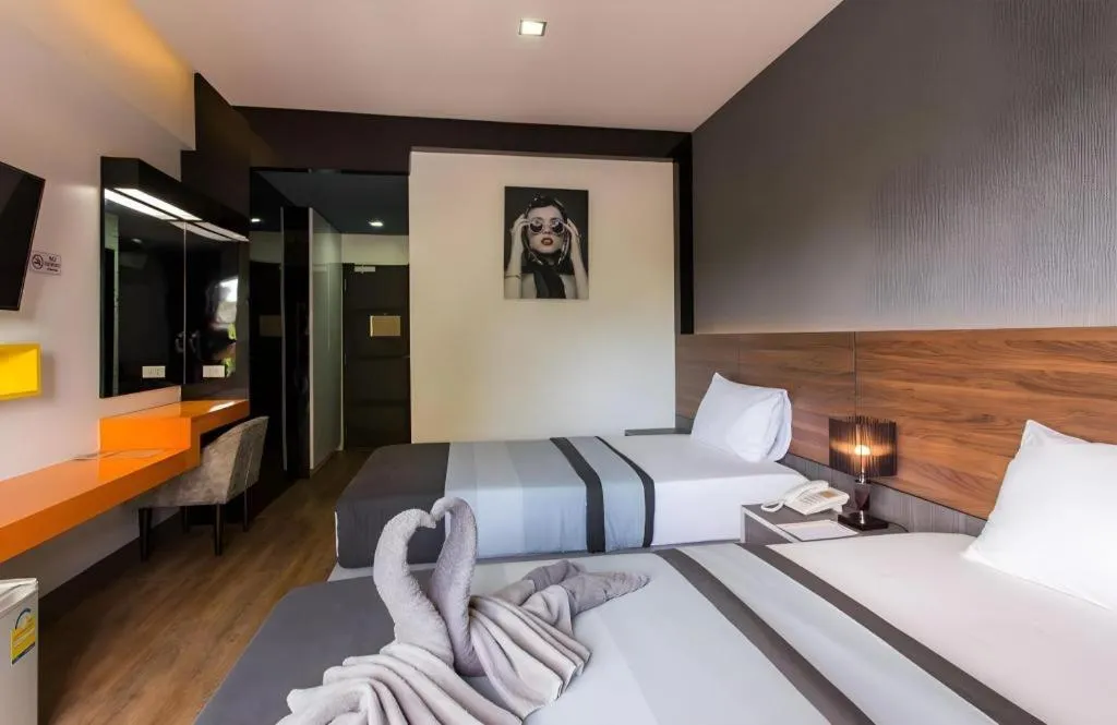 Bed in The Loft Seaside Sriracha Hotel