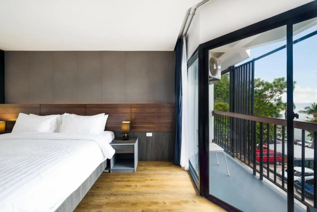 Bed in The Loft Seaside Sriracha Hotel