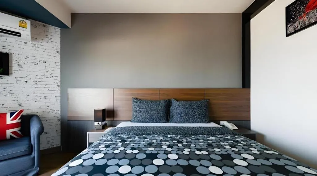 Bed in The Loft Seaside Sriracha Hotel