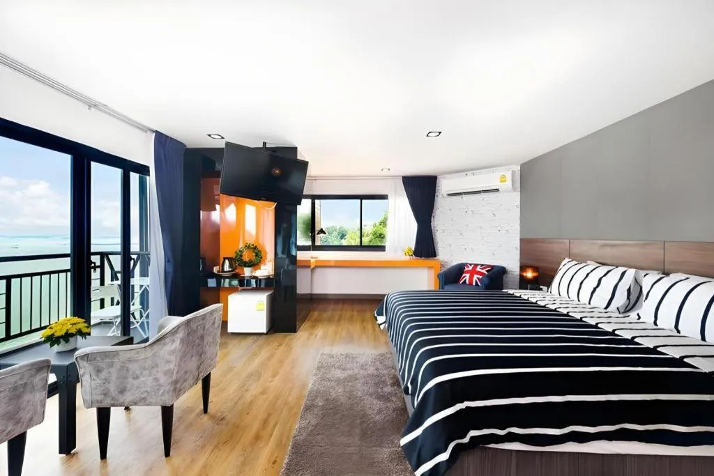 Bed in The Loft Seaside Sriracha Hotel