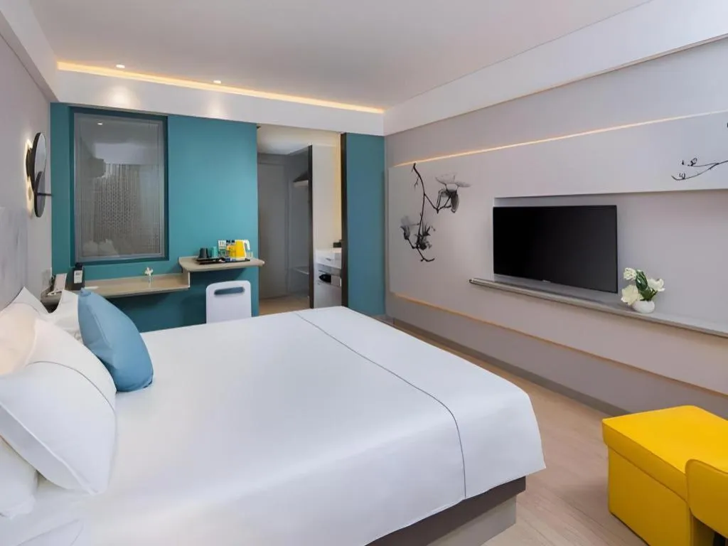 Bed in Magnotel Hotel Shanghai Jinjiang Park Branch