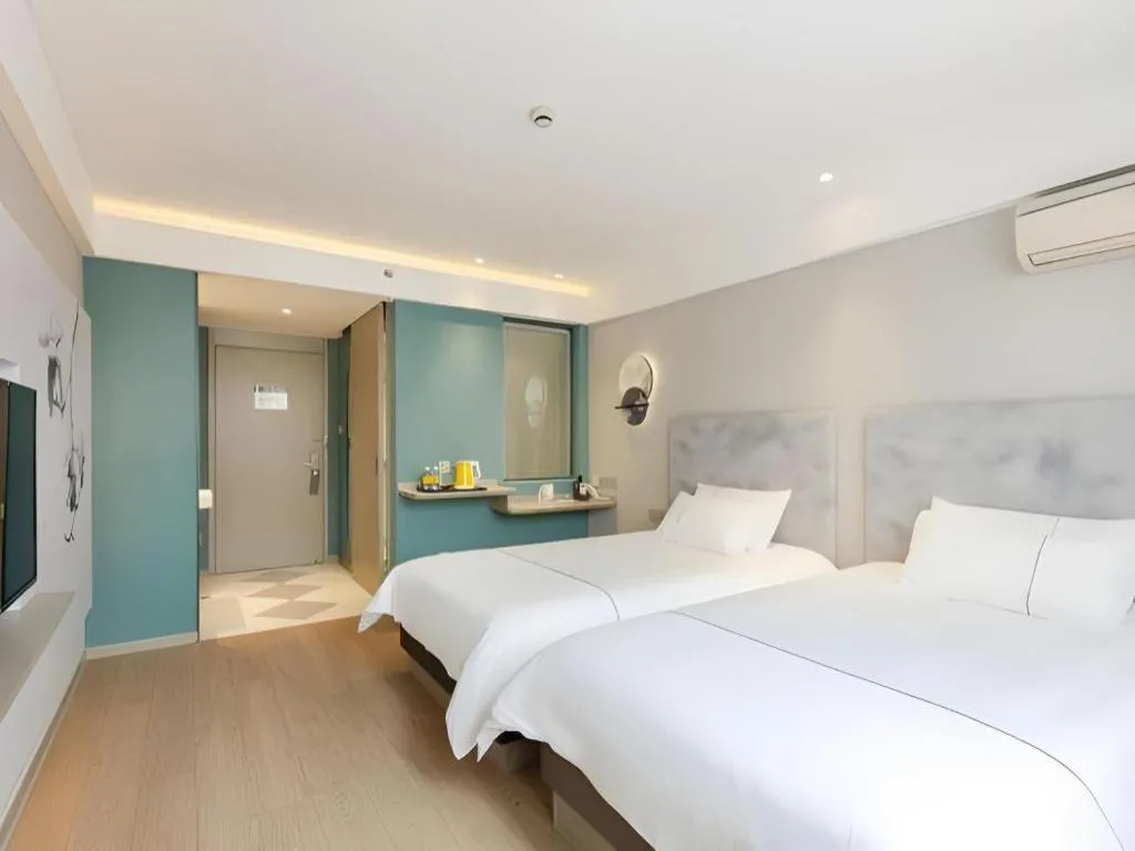 Bed in Magnotel Hotel Shanghai Jinjiang Park Branch