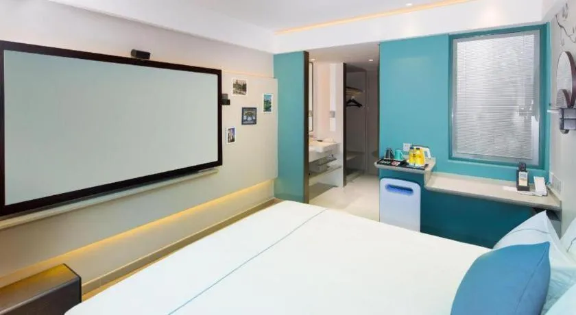 Bed in Magnotel Hotel Shanghai Jinjiang Park Branch