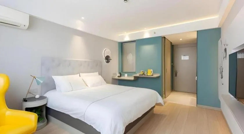 Bed in Magnotel Hotel Shanghai Jinjiang Park Branch