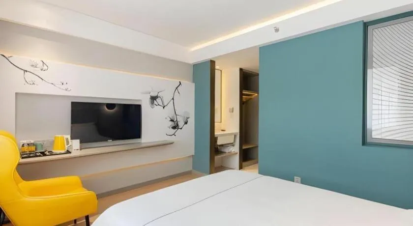 Bed in Magnotel Hotel Shanghai Jinjiang Park Branch