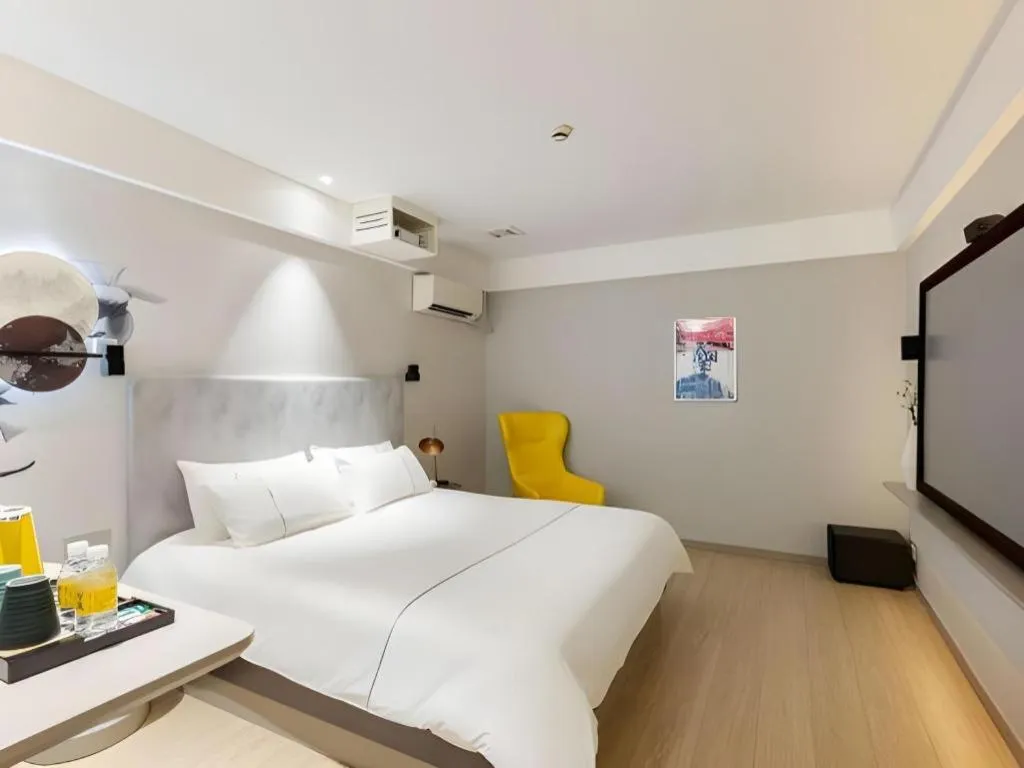 Bed in Magnotel Hotel Shanghai Jinjiang Park Branch