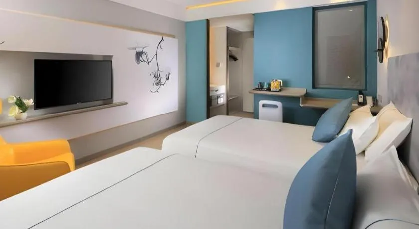 Bed in Magnotel Hotel Shanghai Jinjiang Park Branch