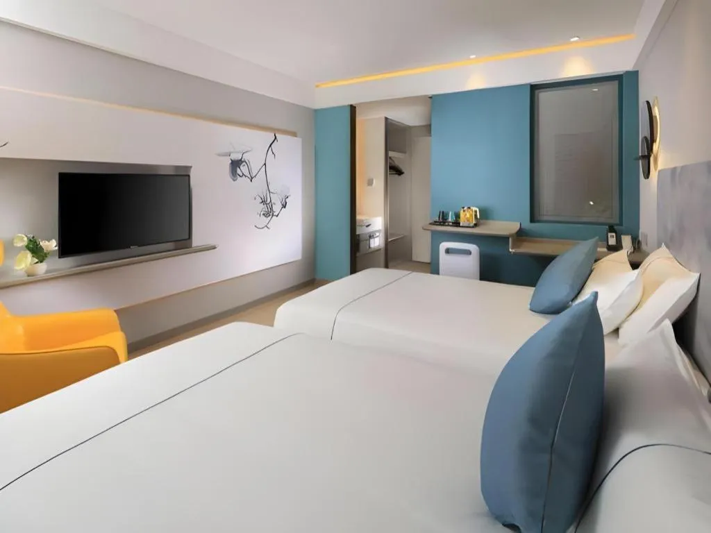 Bed in Magnotel Hotel Shanghai Jinjiang Park Branch