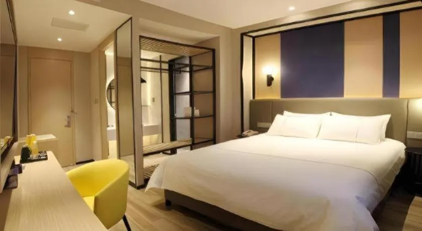 Bed in Magnotel Hotel Shanghai Jinjiang Park Branch