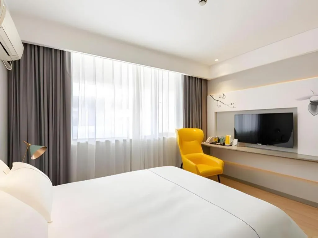 Bed in Magnotel Hotel Shanghai Jinjiang Park Branch