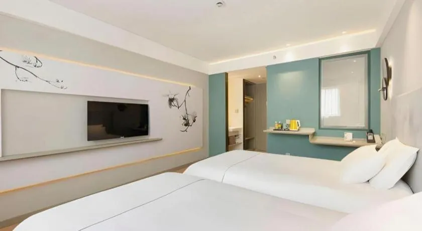 Bed in Magnotel Hotel Shanghai Jinjiang Park Branch