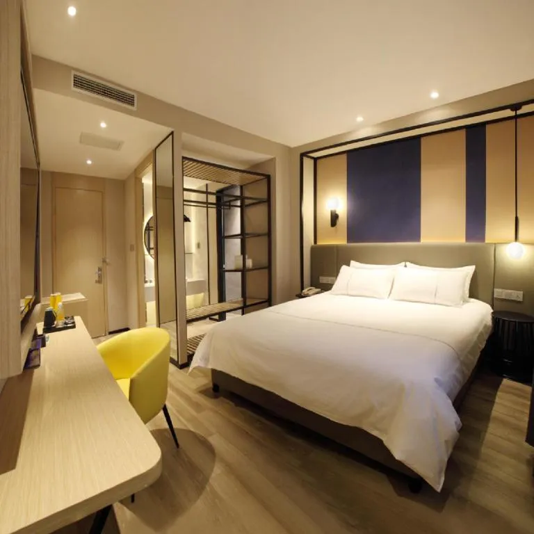 Bed in Magnotel Hotel Shanghai Jinjiang Park Branch