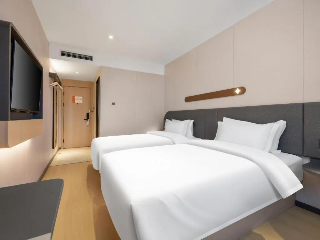 Bed in Jinjiang Inn Beijing Capital International Airport New Expo Metro Station