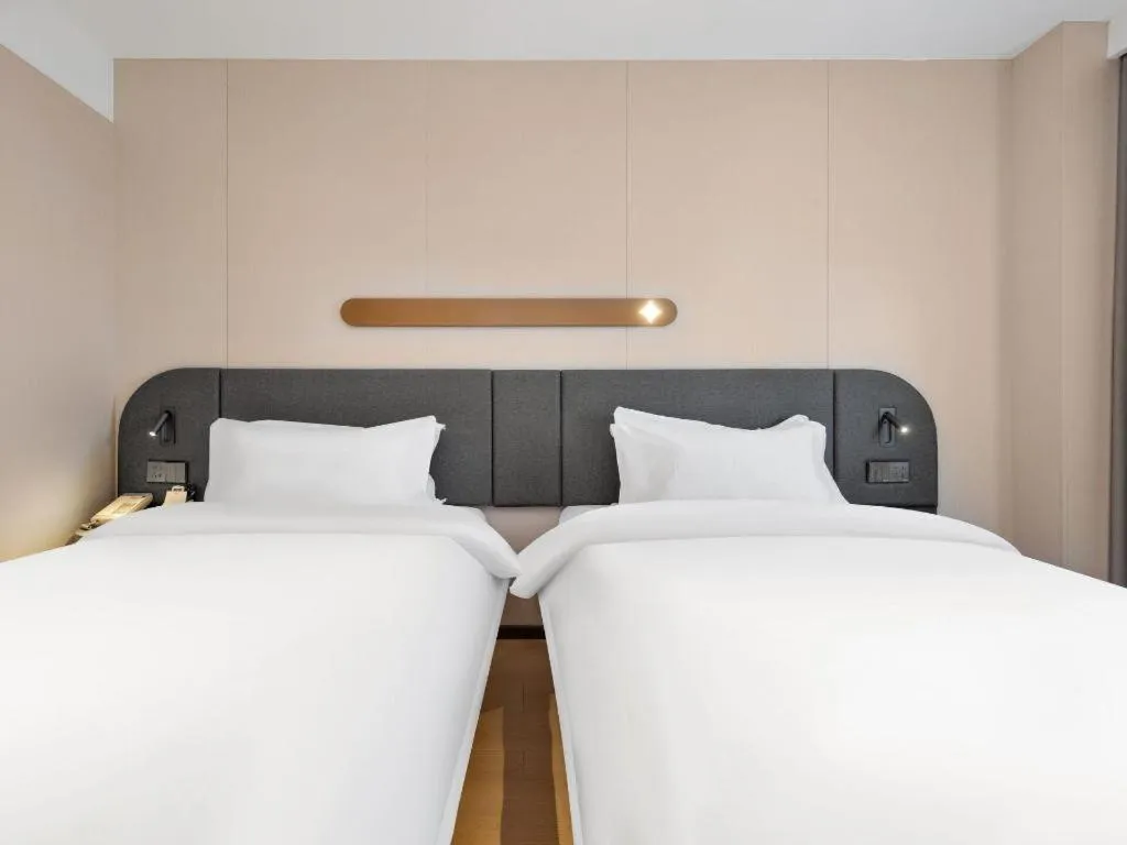 Bed in Jinjiang Inn Beijing Capital International Airport New Expo Metro Station