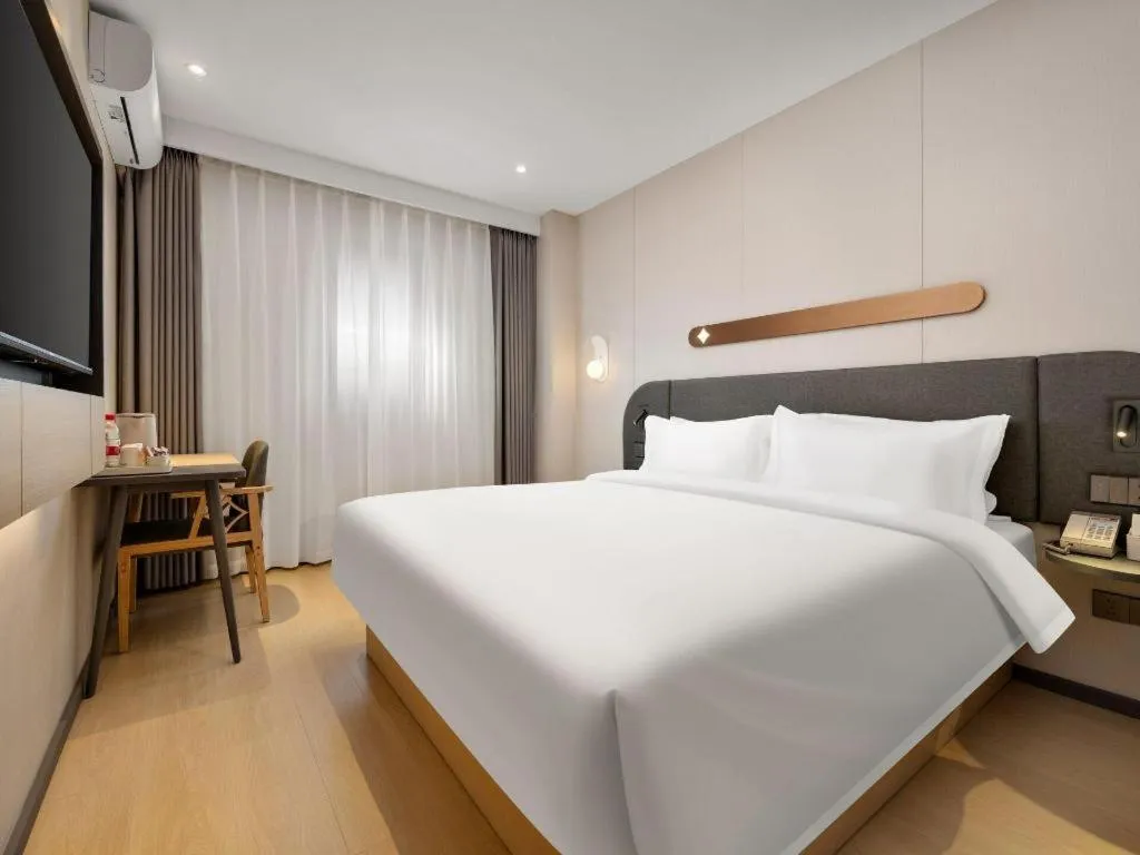 Bed in Jinjiang Inn Beijing Capital International Airport New Expo Metro Station