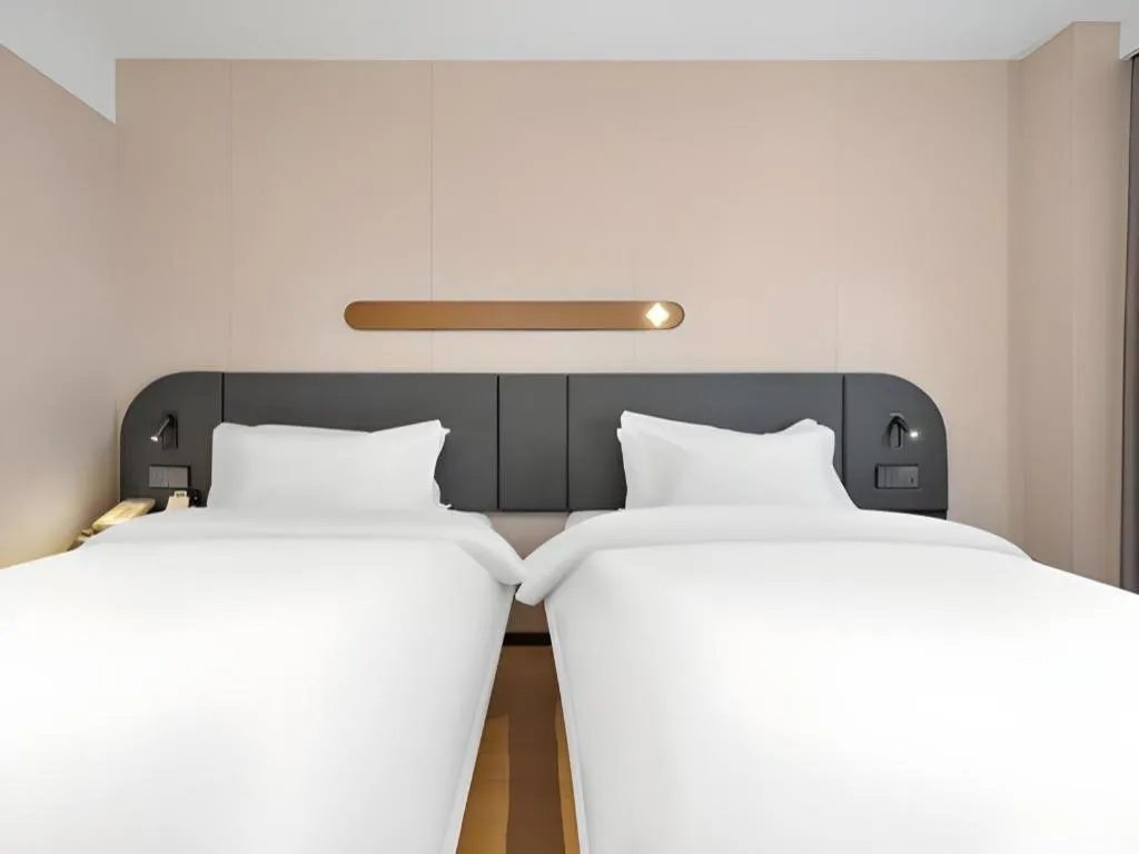 Bed in Jinjiang Inn Beijing Capital International Airport New Expo Metro Station