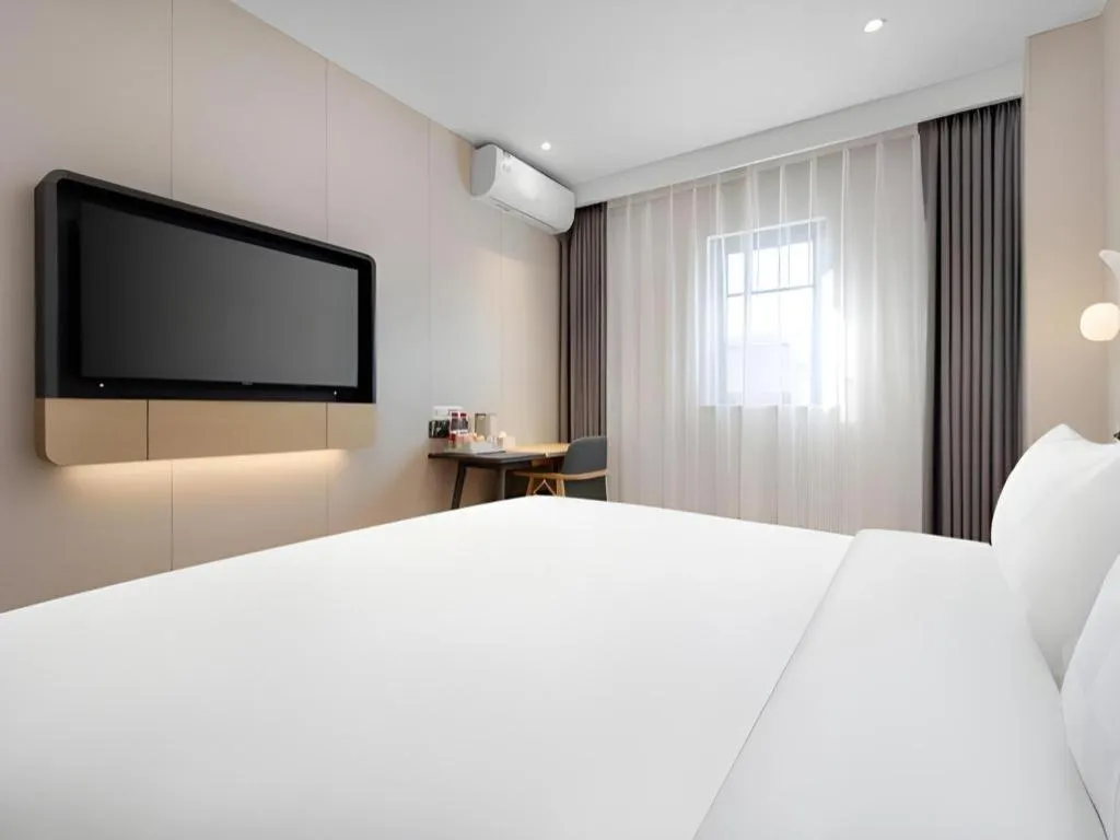 Bed in Jinjiang Inn Beijing Capital International Airport New Expo Metro Station