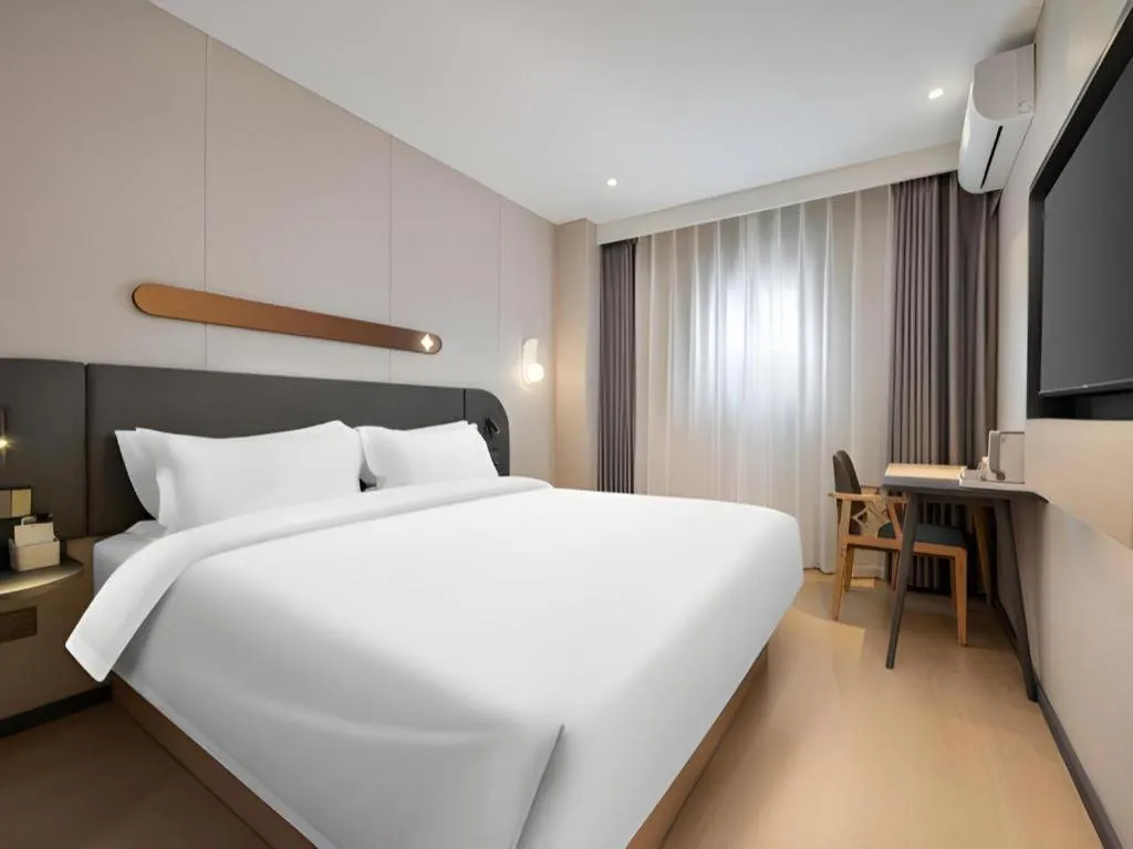 Bed in Jinjiang Inn Beijing Capital International Airport New Expo Metro Station