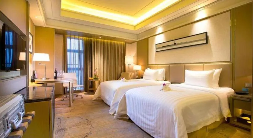 Bed in New Century Grand Hotel Hangzhou Zheshang