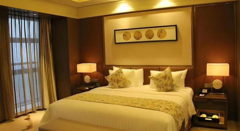 Bed in New Century Grand Hotel Hangzhou Zheshang