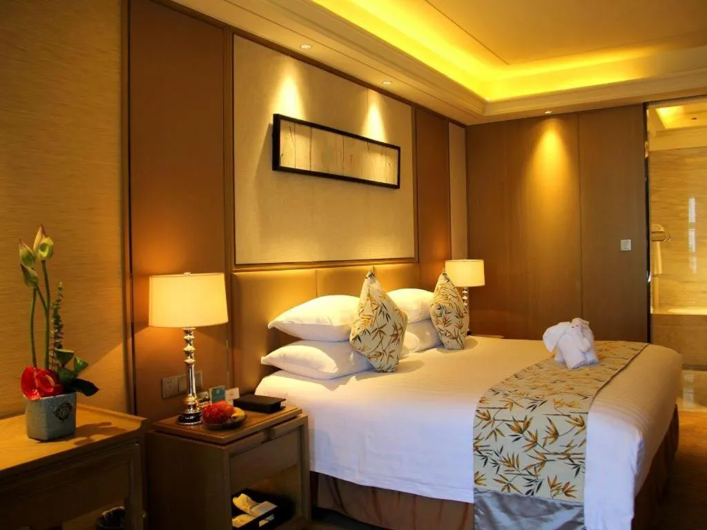 Bed in New Century Grand Hotel Hangzhou Zheshang