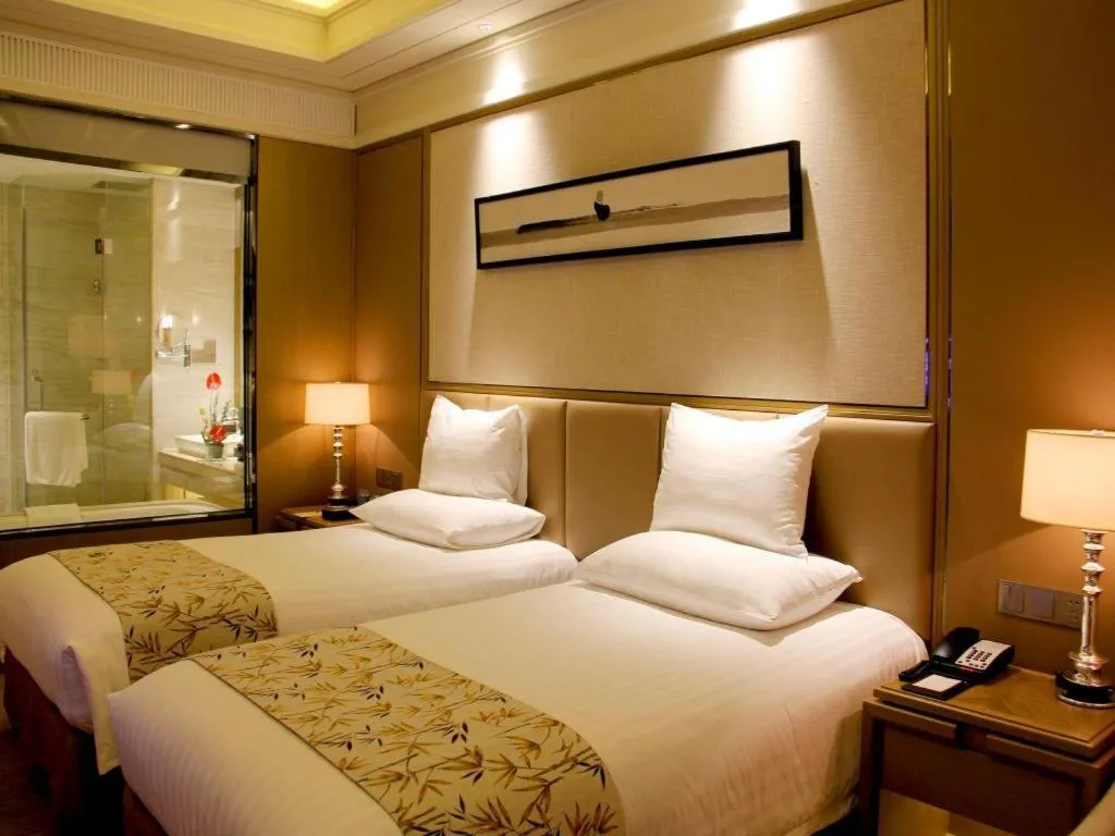 Bed in New Century Grand Hotel Hangzhou Zheshang