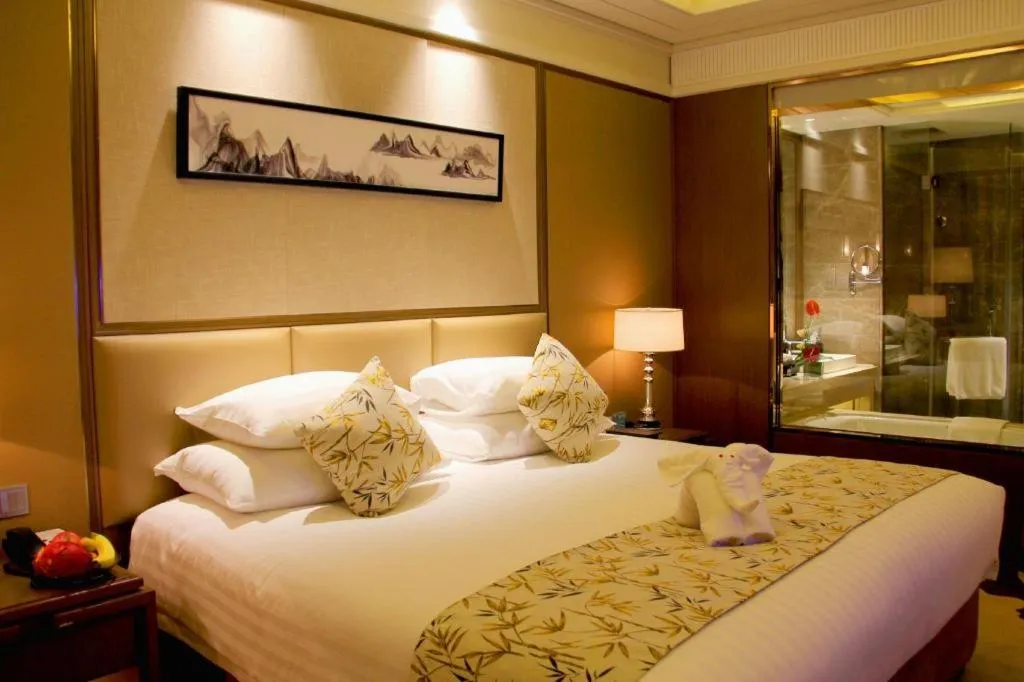 Bed in New Century Grand Hotel Hangzhou Zheshang