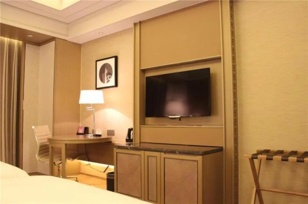 Bed in New Century Grand Hotel Hangzhou Zheshang