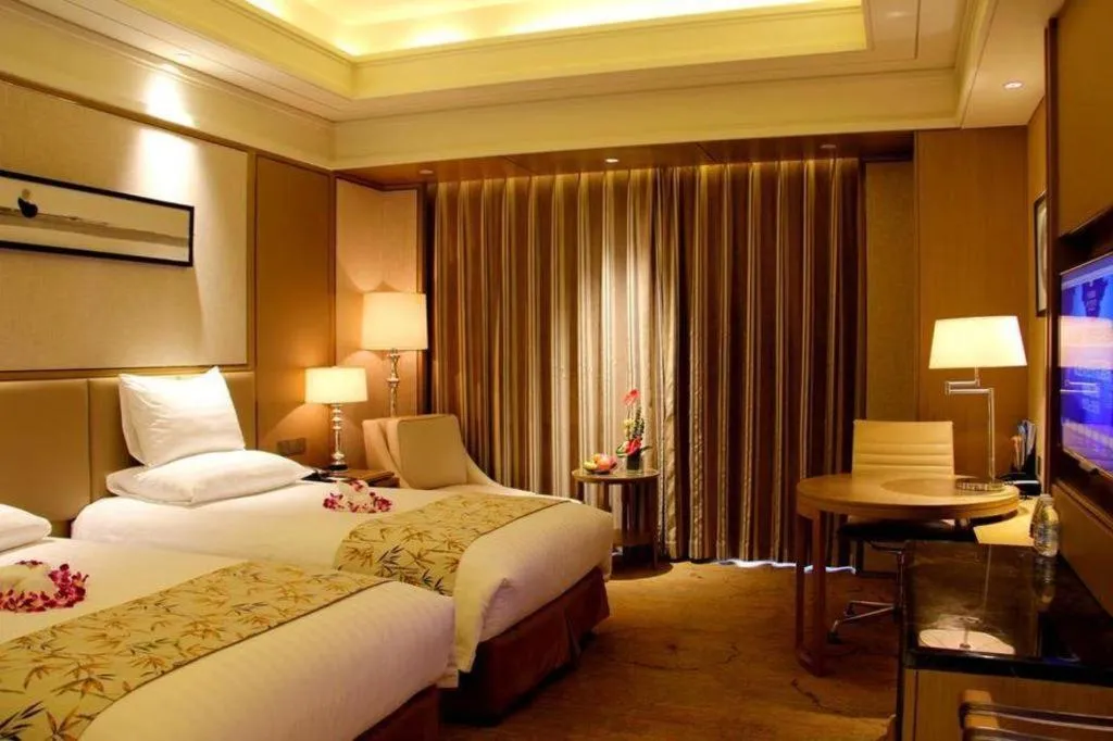 Bed in New Century Grand Hotel Hangzhou Zheshang