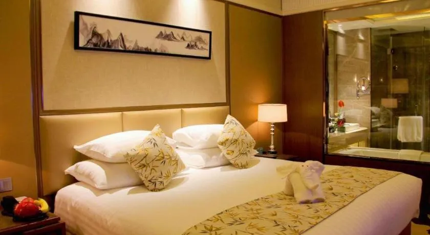 Bed in New Century Grand Hotel Hangzhou Zheshang