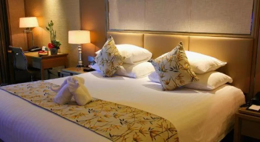 Bed in New Century Grand Hotel Hangzhou Zheshang