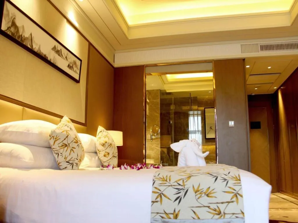 Bed in New Century Grand Hotel Hangzhou Zheshang
