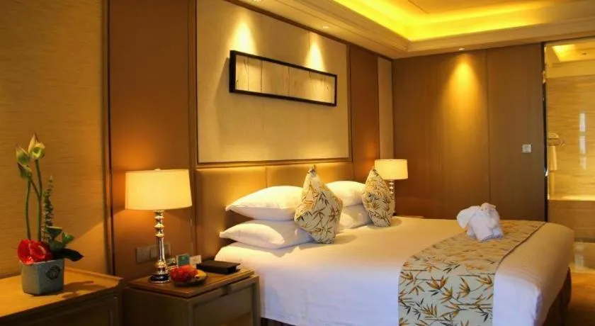 Bed in New Century Grand Hotel Hangzhou Zheshang