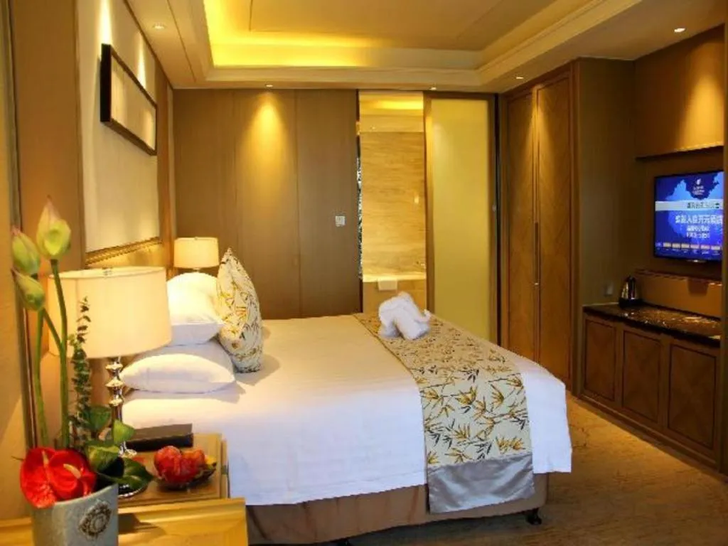 Bed in New Century Grand Hotel Hangzhou Zheshang