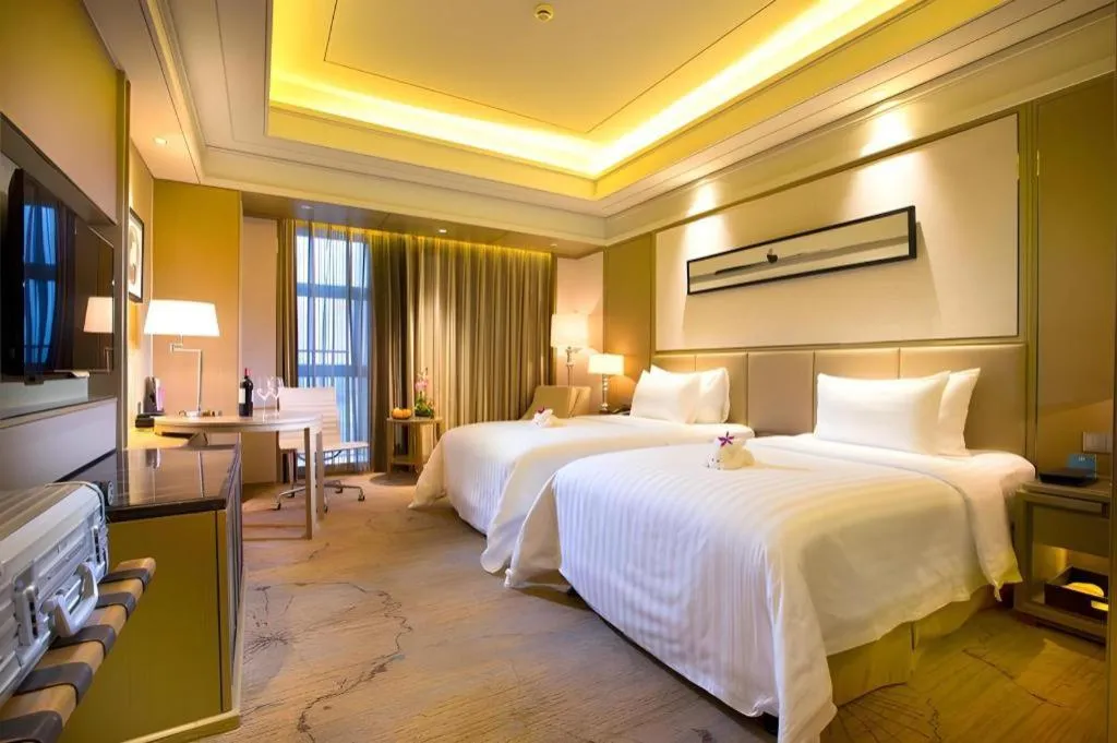 Bed in New Century Grand Hotel Hangzhou Zheshang