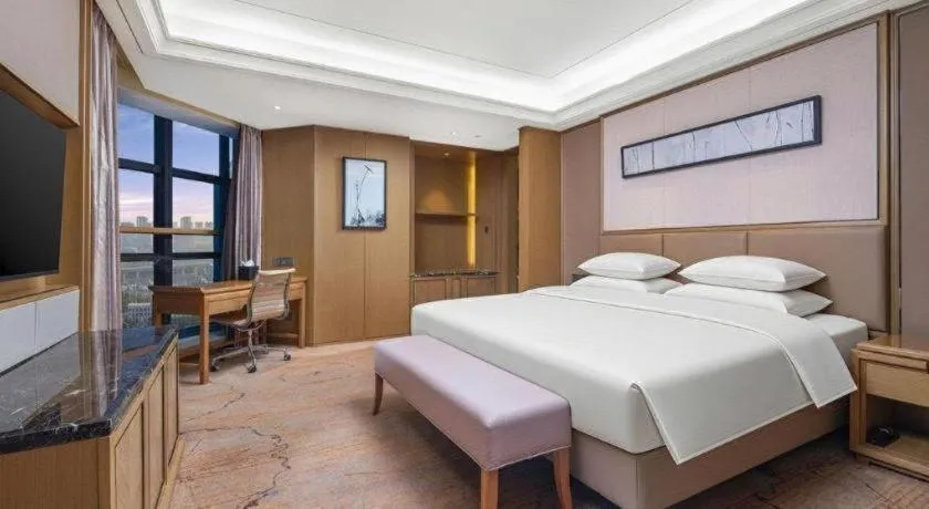 Bed in New Century Grand Hotel Hangzhou Zheshang
