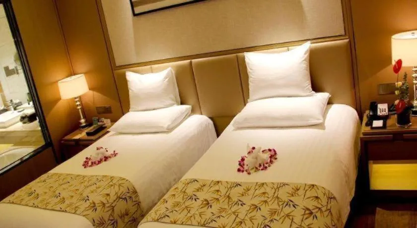 Bed in New Century Grand Hotel Hangzhou Zheshang