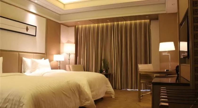 Bed in New Century Grand Hotel Hangzhou Zheshang