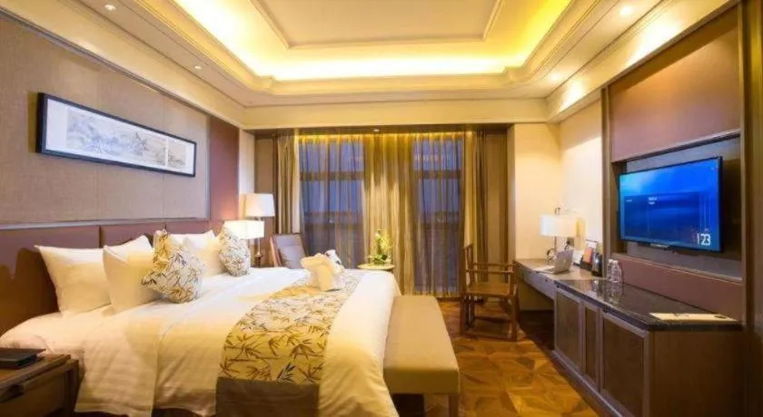 Bed in New Century Grand Hotel Hangzhou Zheshang