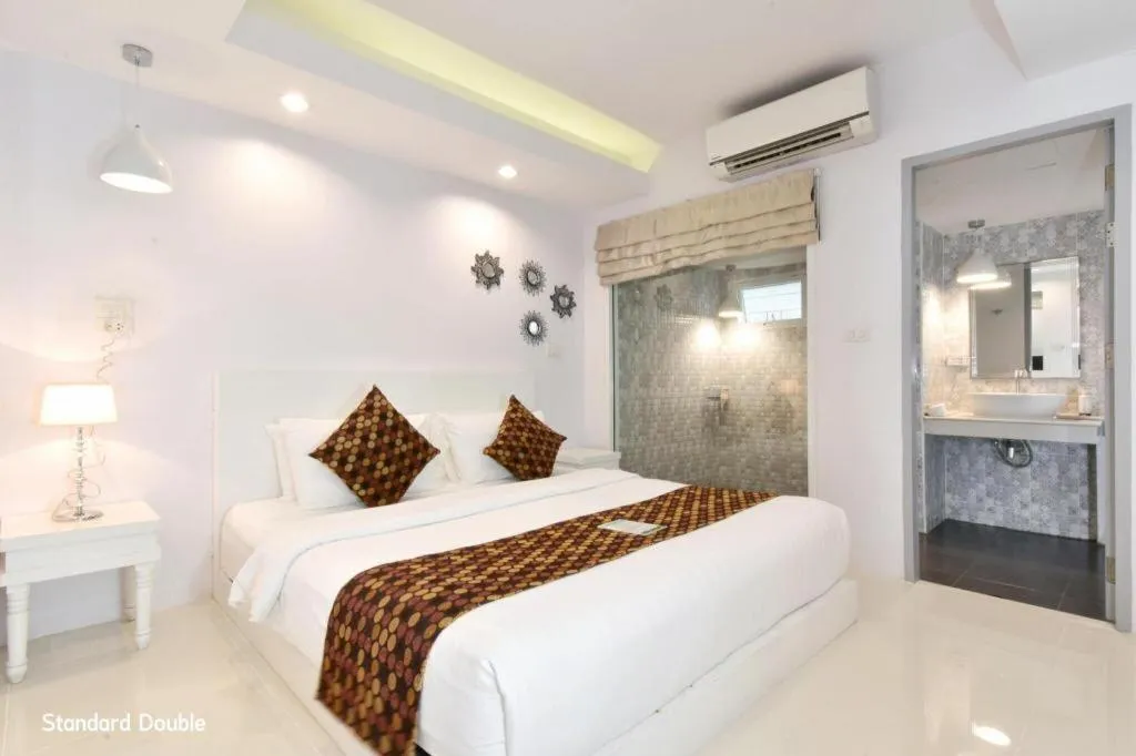 Bed in NanNakara Boutique Hotel