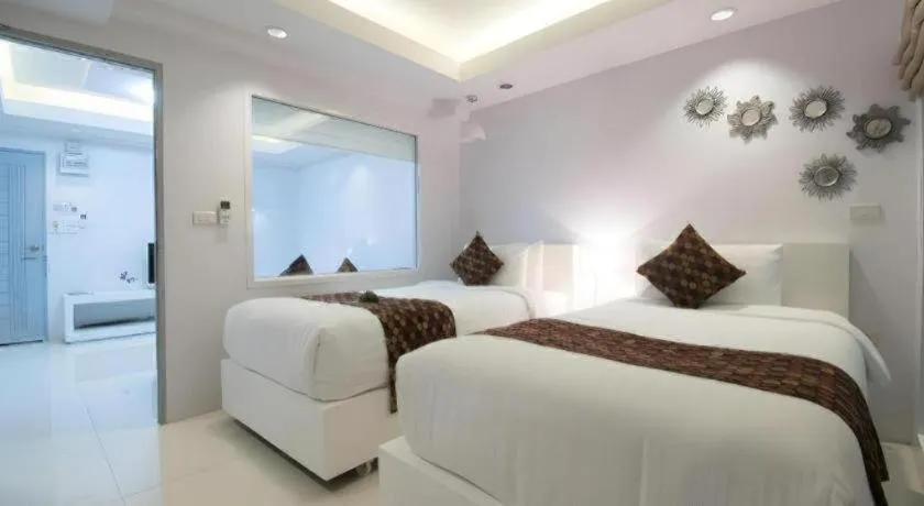 Bed in NanNakara Boutique Hotel