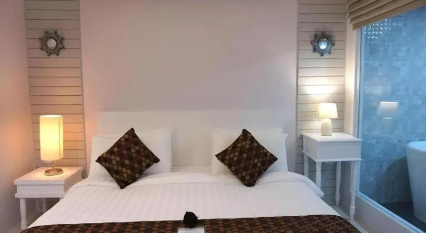 Bed in NanNakara Boutique Hotel