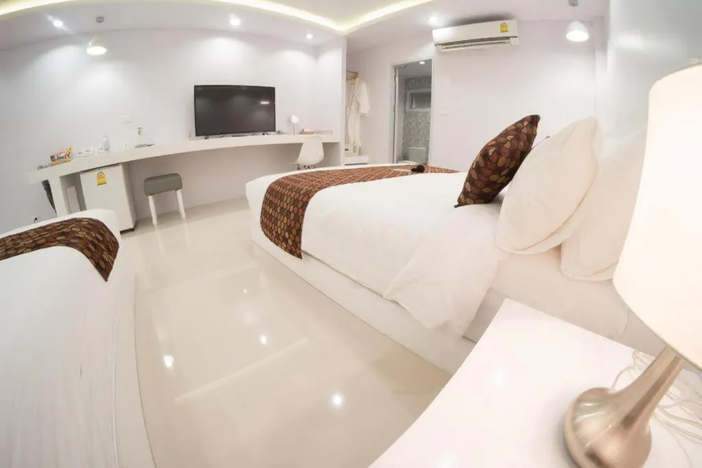 Bed in NanNakara Boutique Hotel