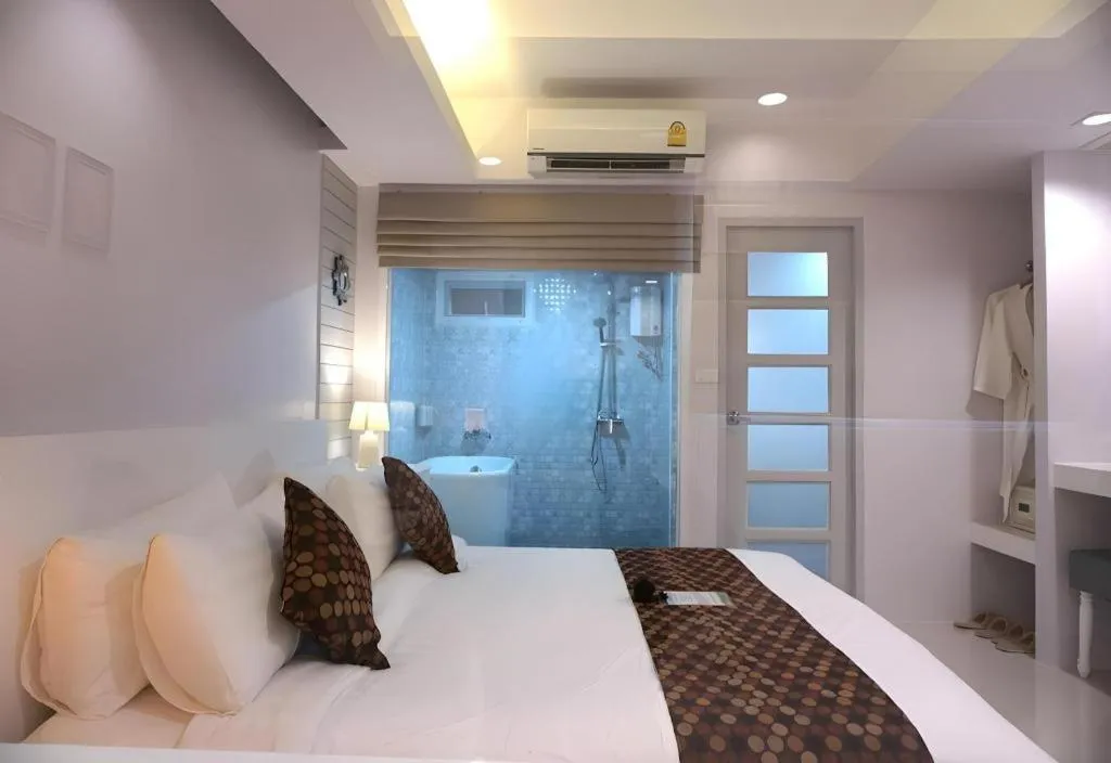 Bed in NanNakara Boutique Hotel