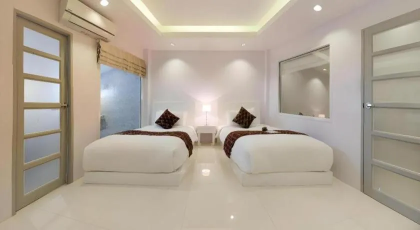 Bed in NanNakara Boutique Hotel