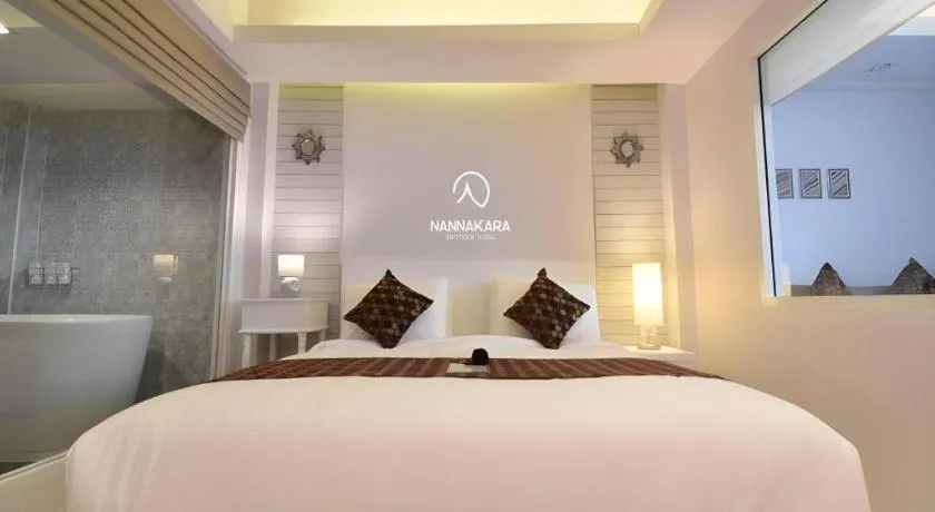 Bed in NanNakara Boutique Hotel