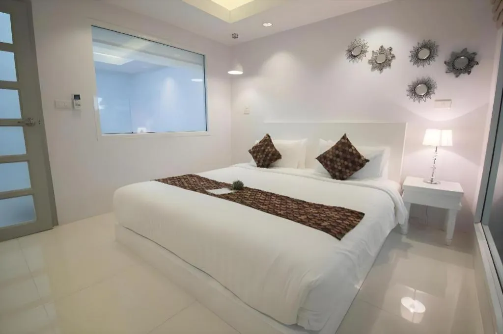 Bed in NanNakara Boutique Hotel