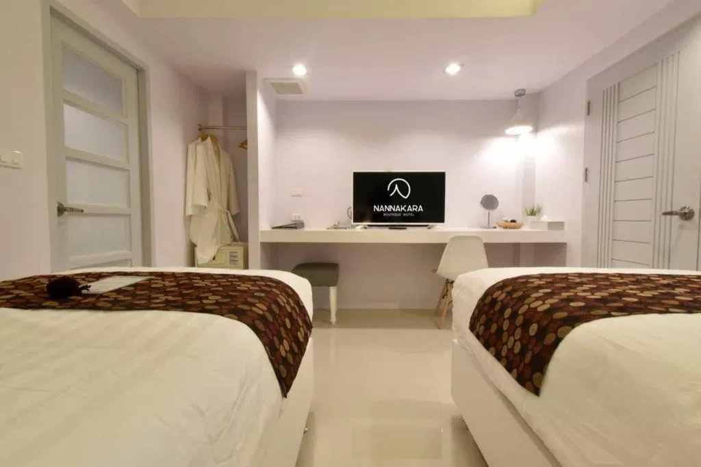 Bed in NanNakara Boutique Hotel