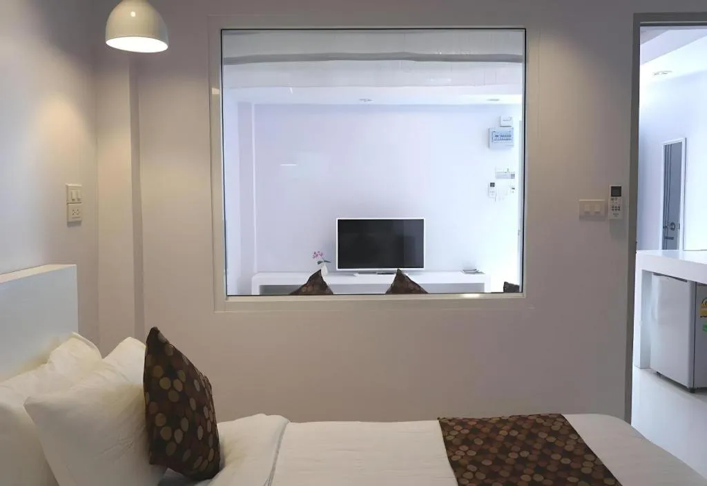 Bed in NanNakara Boutique Hotel