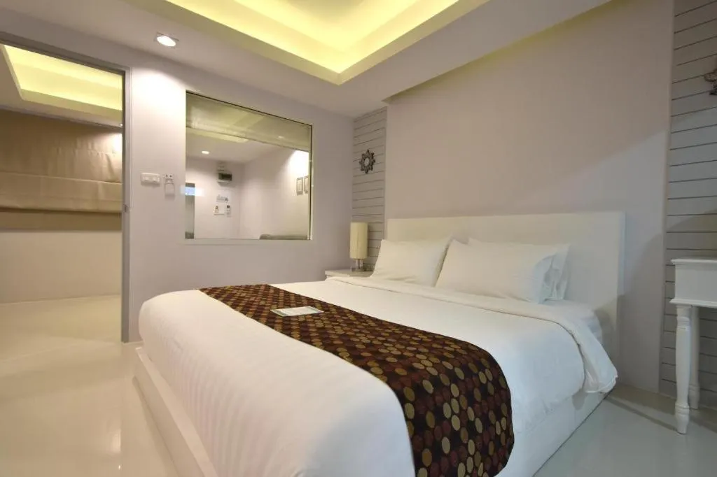 Bed in NanNakara Boutique Hotel